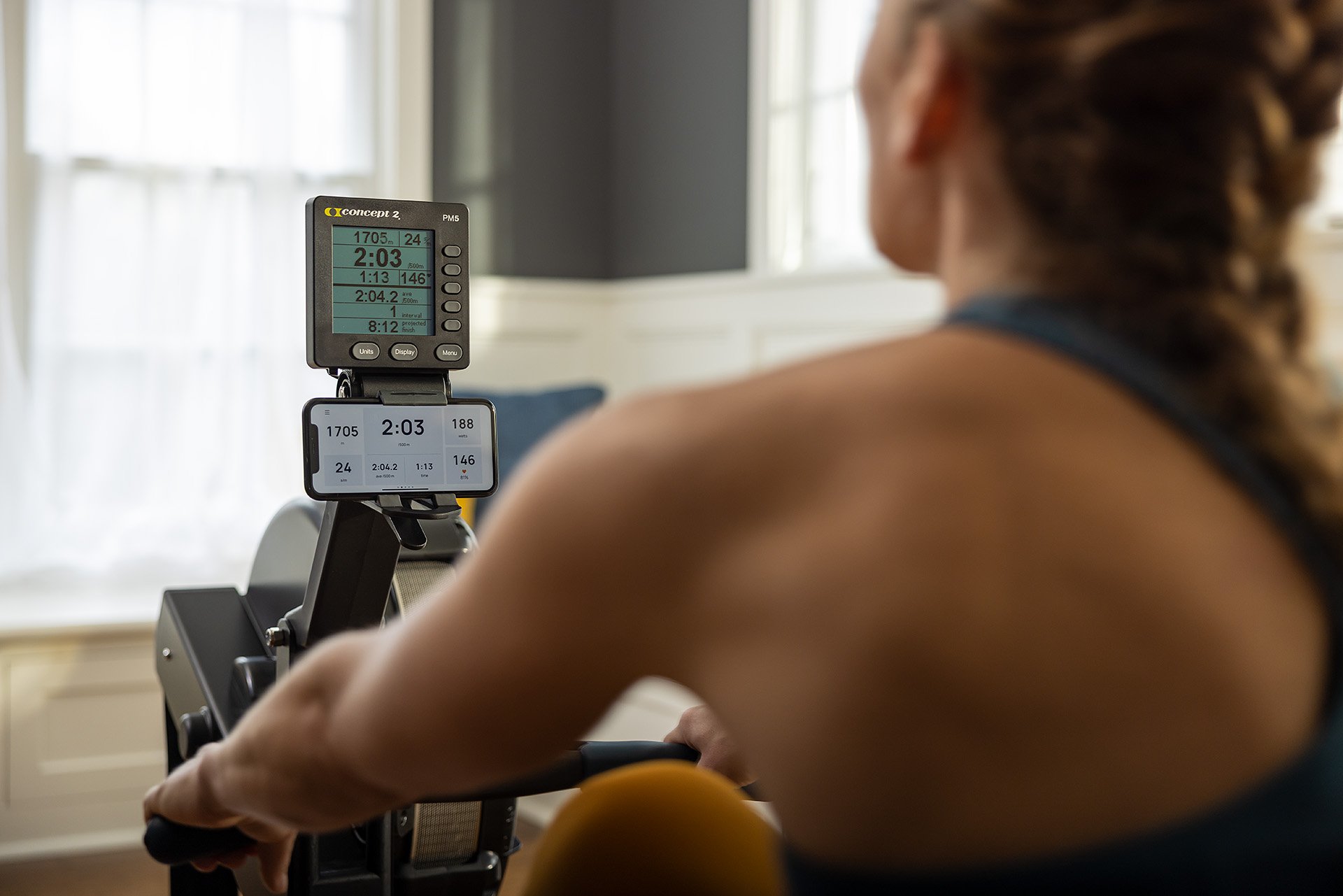 Woman rowing while using the ErgData app