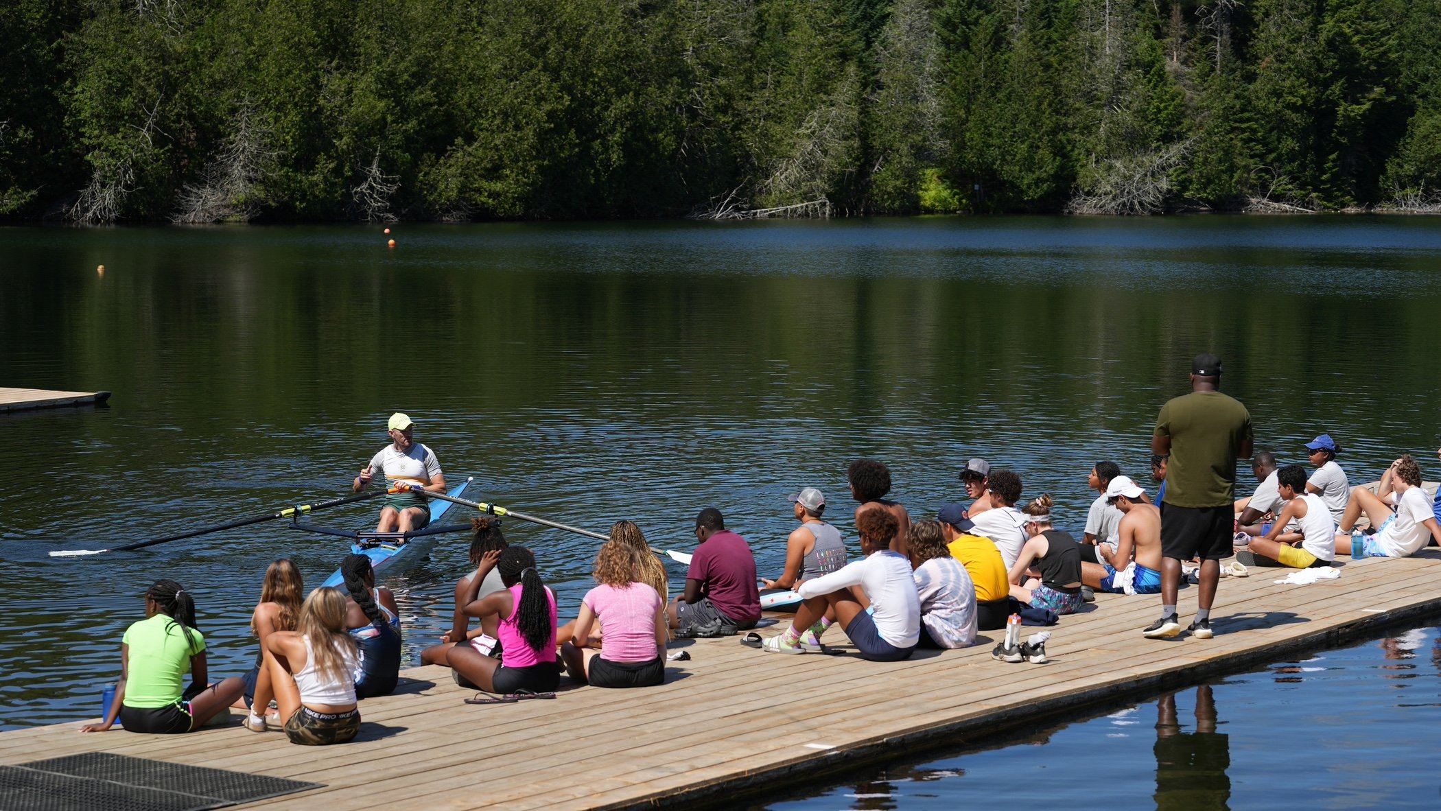 Athletes learning how to scull at a rowing camp