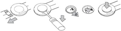 Image showing how to open the battery door on a Suunto Comfort heart rate belt.