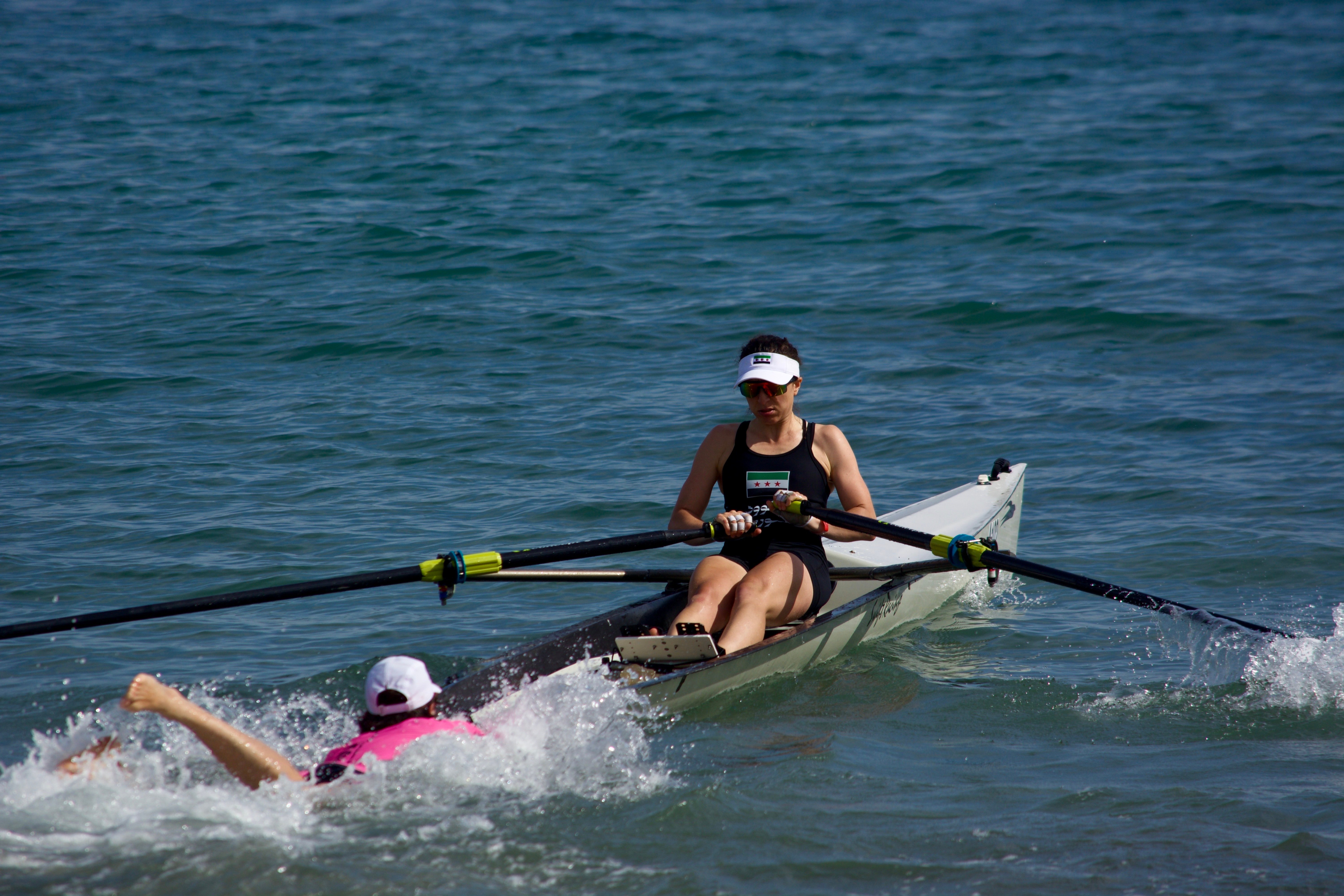 woman rowing at beach sprint event