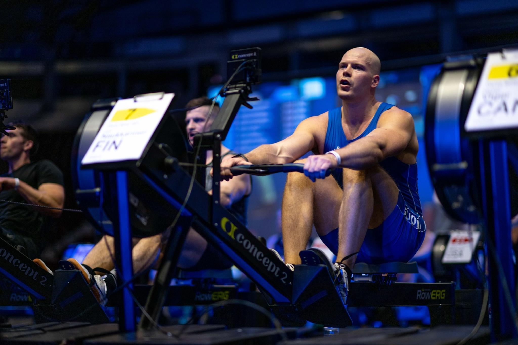Man competing at wrich on concept2 rowerg