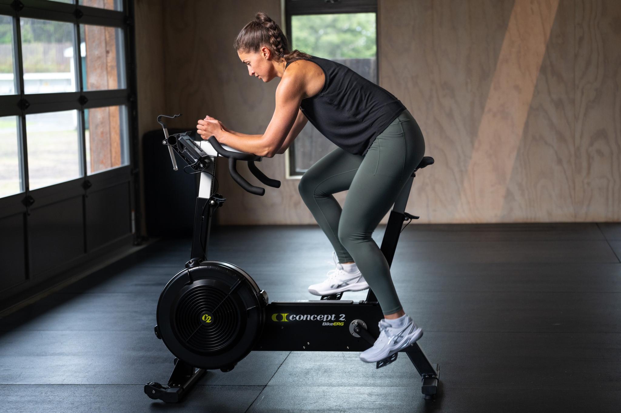 woman on bikeerg in gym